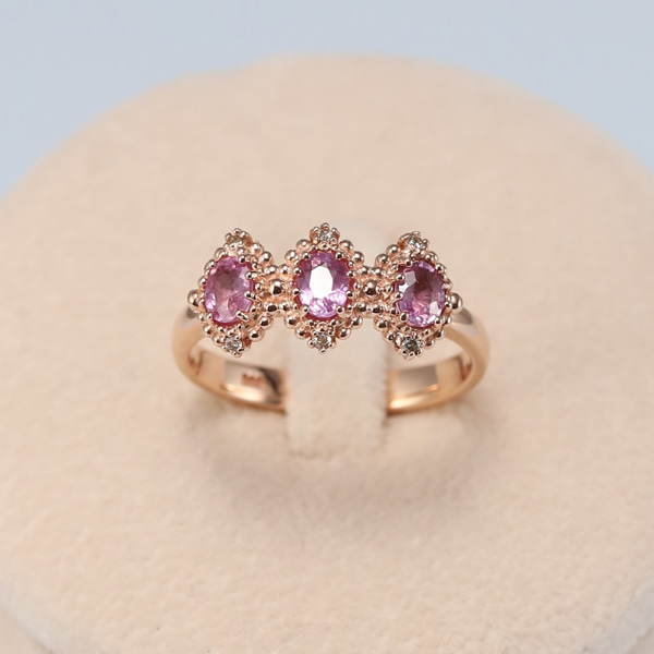 Pink sapphire three-stone ring